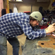 Clay grinds down the bolts on the gas tank skid plate so they won’t hang up on rocks.